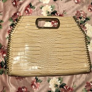 Cream handbag with gold hardware